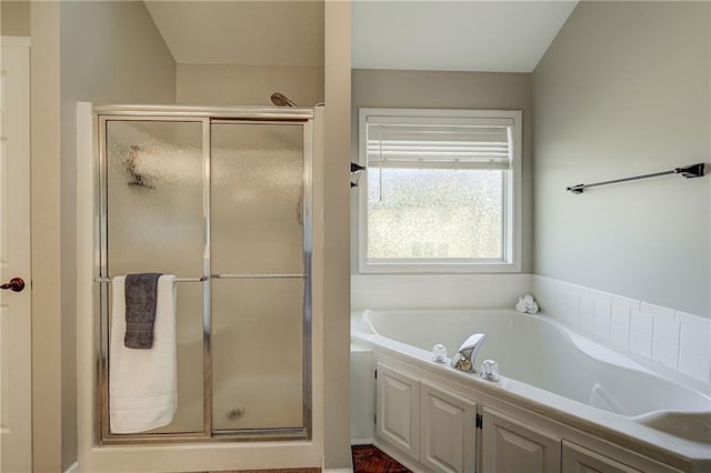 full bathroom with a garden tub and a shower stall