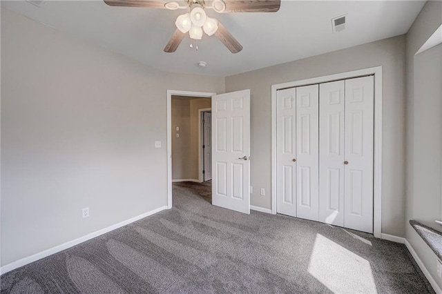 unfurnished bedroom with visible vents, baseboards, a ceiling fan, carpet, and a closet