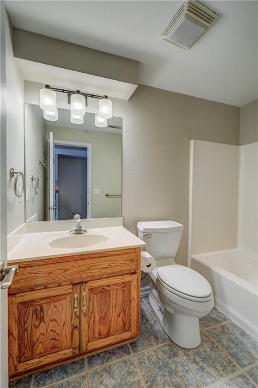 bathroom featuring visible vents, vanity, and toilet