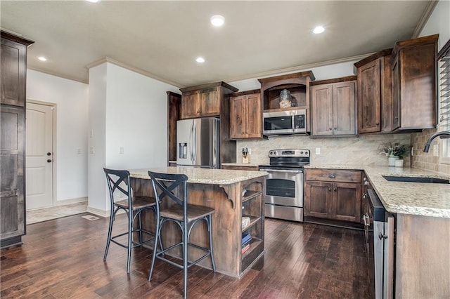 kitchen with open shelves, stainless steel appliances, tasteful backsplash, and a sink