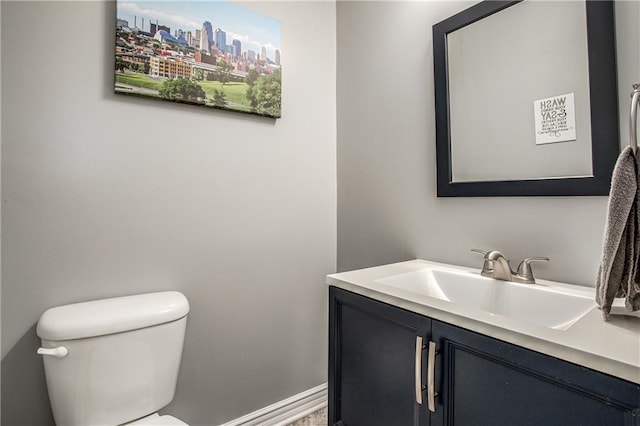 bathroom featuring vanity, a view of city, and toilet