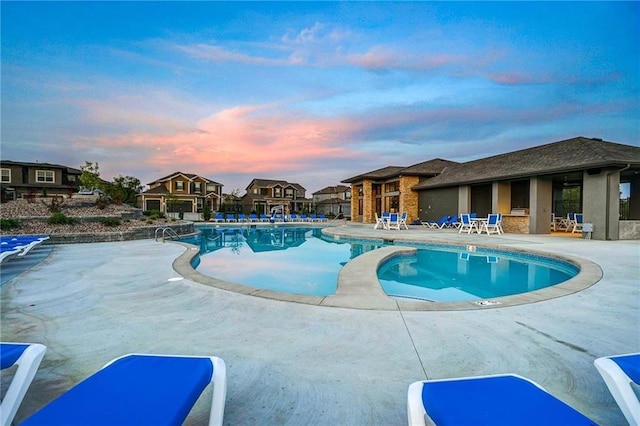 community pool with a patio area