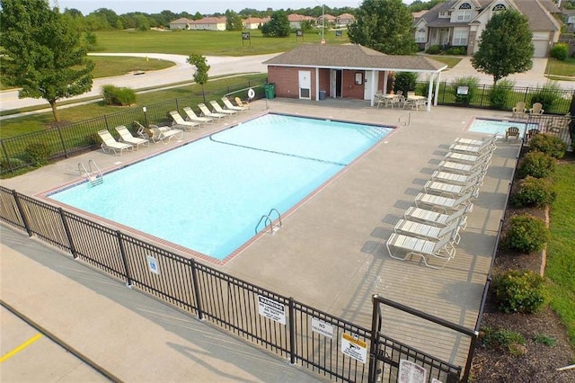 pool featuring a patio and fence