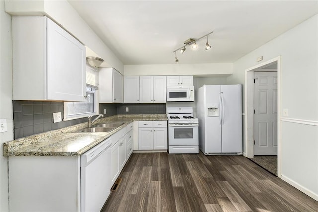 kitchen with white cabinetry, sink, white appliances, dark hardwood / wood-style floors, and decorative backsplash