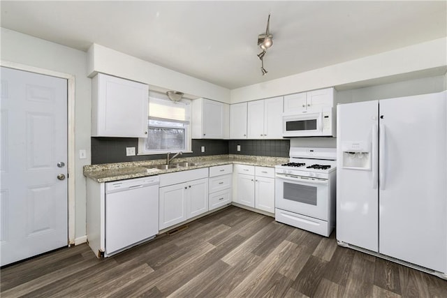 kitchen with dark hardwood / wood-style flooring, sink, white appliances, and white cabinetry