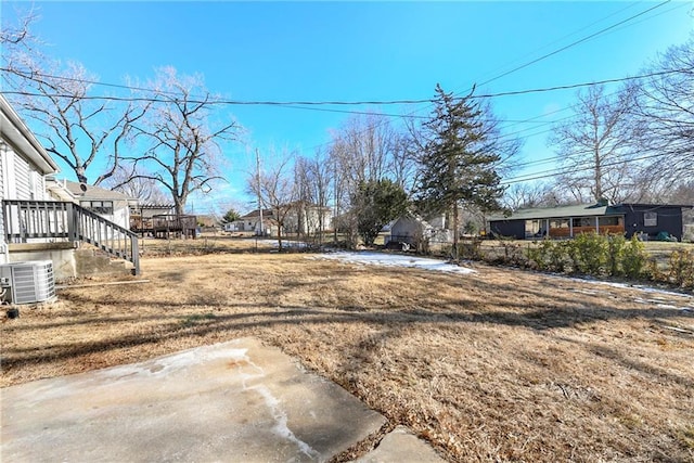 view of yard featuring a patio and central air condition unit