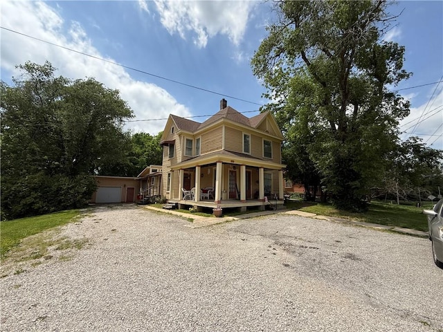 513 S Business Highway 13, Lexington, MO 64067 - victorian-style house featuring a porch and gravel driveway
