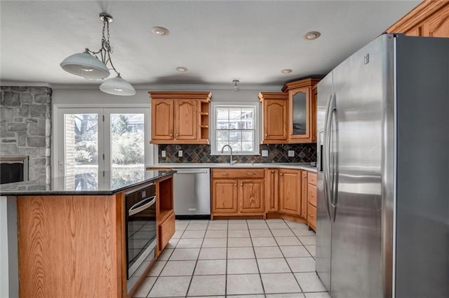7924 Roe Ave, Prairie Village, KS 66208 - kitchen featuring crown molding, open shelves, decorative backsplash, a sink, and stainless steel appliances