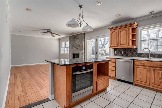 7924 Roe Ave, Prairie Village, KS 66208 - kitchen featuring crown molding, open shelves, appliances with stainless steel finishes, a sink, and open floor plan