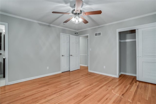 7924 Roe Ave, Prairie Village, KS 66208 - unfurnished bedroom featuring crown molding, baseboards, visible vents, and light wood-style floors