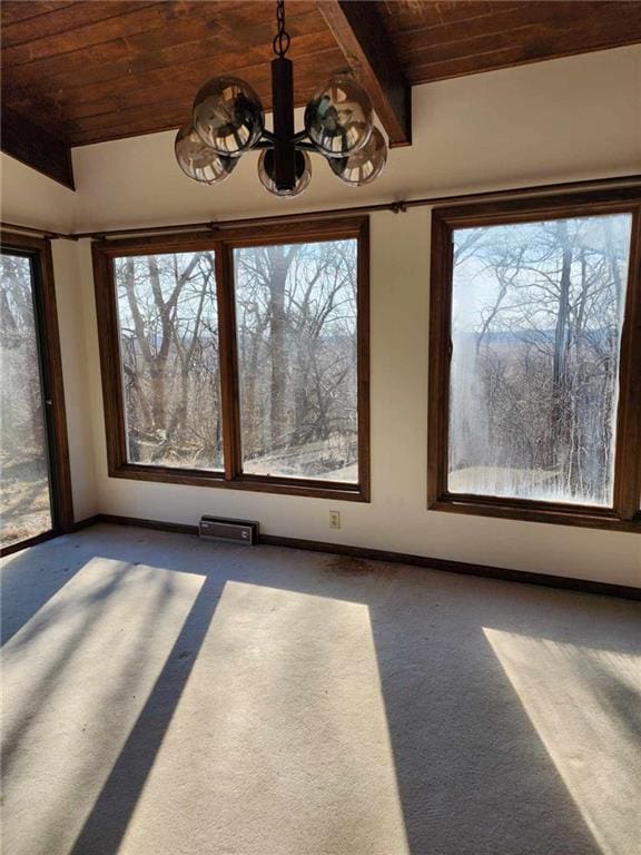 11425 45th Hwy N, Platte City, MO 64079 - unfurnished dining area featuring wooden ceiling, carpet floors, baseboards, and a chandelier
