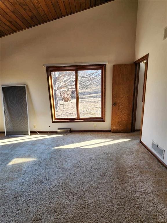 11425 45th Hwy N, Platte City, MO 64079 - carpeted empty room featuring vaulted ceiling, wood ceiling, and baseboards