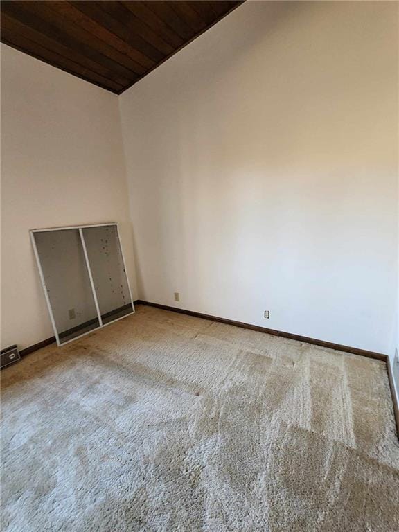 11425 45th Hwy N, Platte City, MO 64079 - unfurnished room featuring wooden ceiling, carpet floors, lofted ceiling, and baseboards