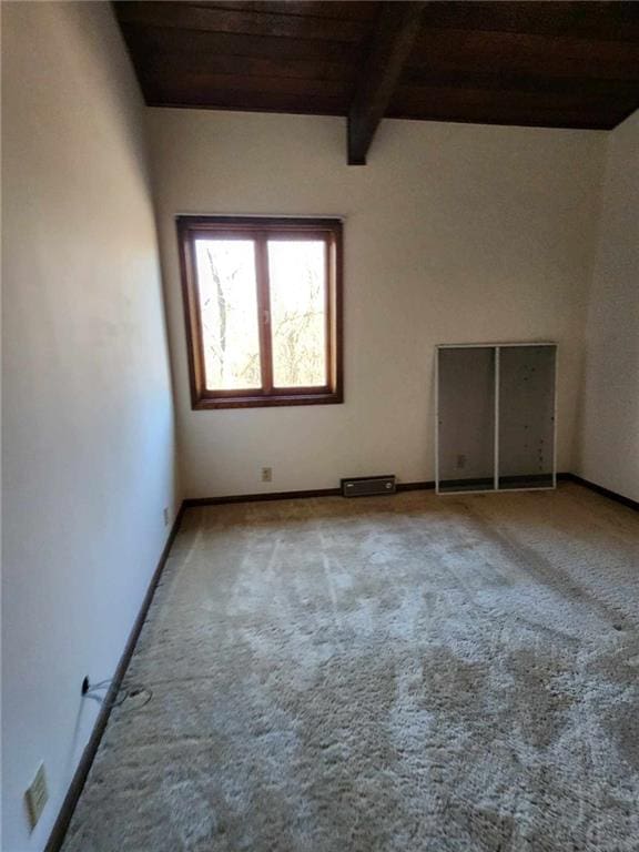 11425 45th Hwy N, Platte City, MO 64079 - empty room with wood ceiling with exposed beams, carpet, and baseboards