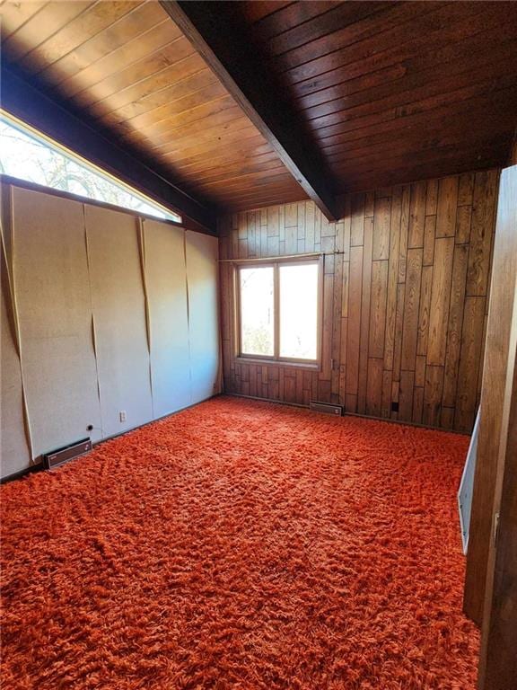 11425 45th Hwy N, Platte City, MO 64079 - carpeted empty room featuring wood ceiling with exposed beams and wooden walls
