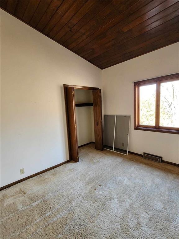 11425 45th Hwy N, Platte City, MO 64079 - unfurnished bedroom with vaulted ceiling, wood ceiling, carpet flooring, and baseboards