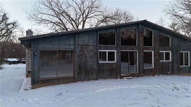 11425 45th Hwy N, Platte City, MO 64079 - view of snow covered exterior with a chimney