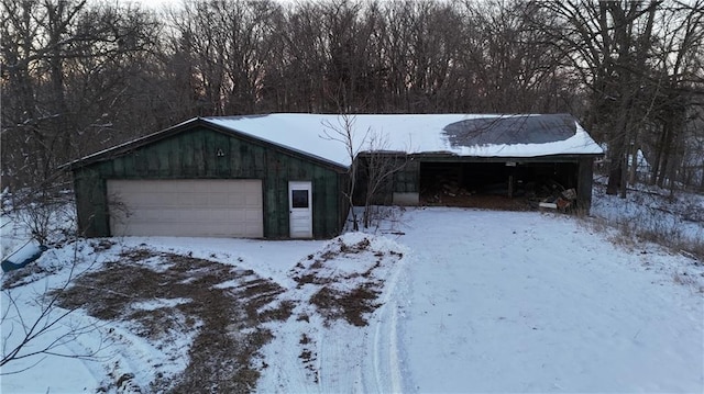 11425 45th Hwy N, Platte City, MO 64079 - snow covered garage with a detached garage
