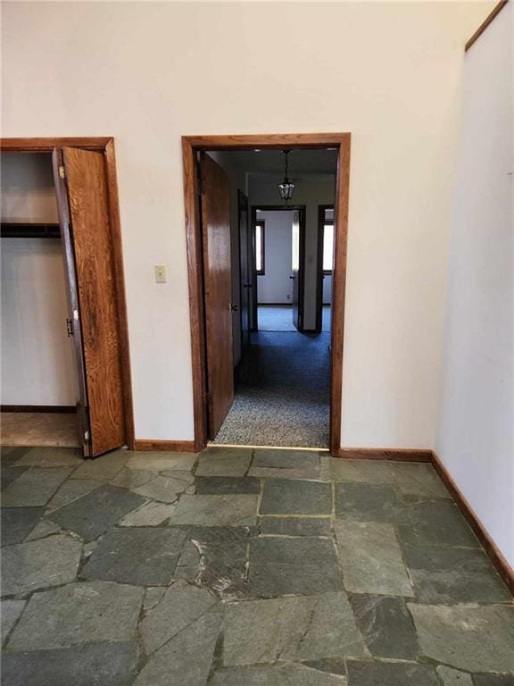 11425 45th Hwy N, Platte City, MO 64079 - corridor with stone tile flooring and baseboards