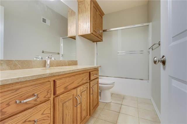 full bathroom featuring visible vents, toilet, tile patterned flooring, enclosed tub / shower combo, and vanity