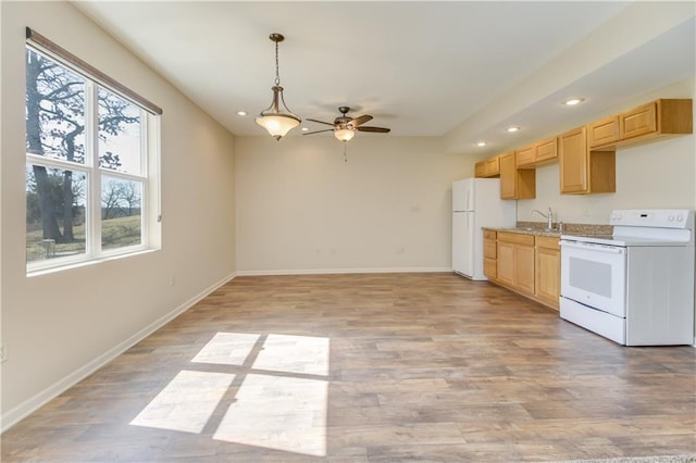 kitchen with light countertops, recessed lighting, light wood-style floors, white appliances, and a ceiling fan