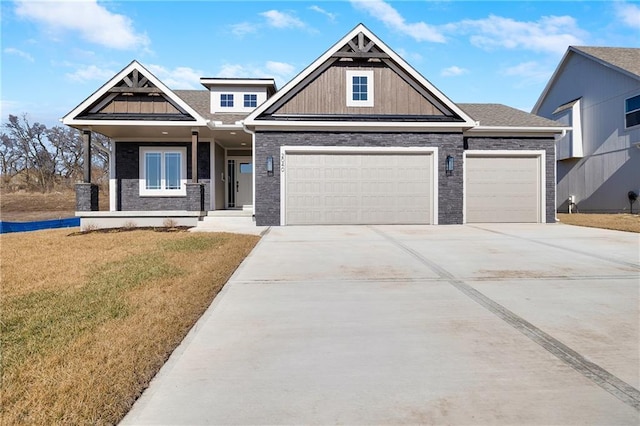 view of front facade with a garage and a front lawn