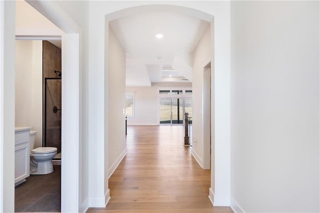 hall with light wood-type flooring