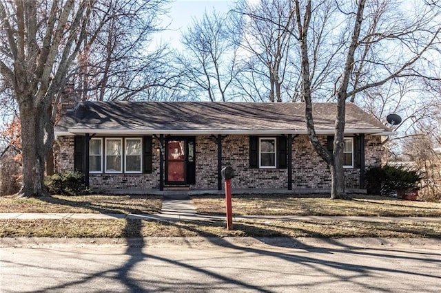 single story home with brick siding