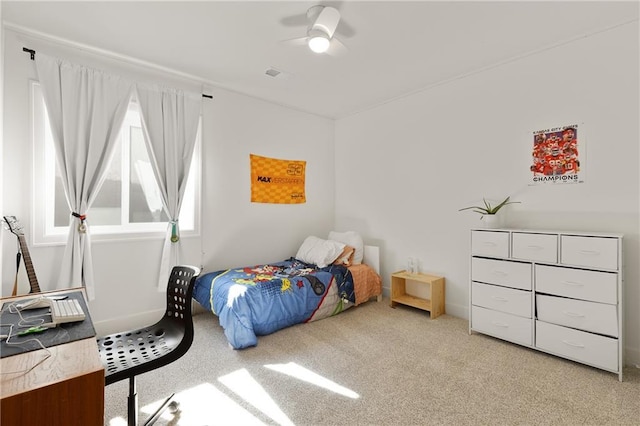 bedroom with light carpet, ceiling fan, and visible vents