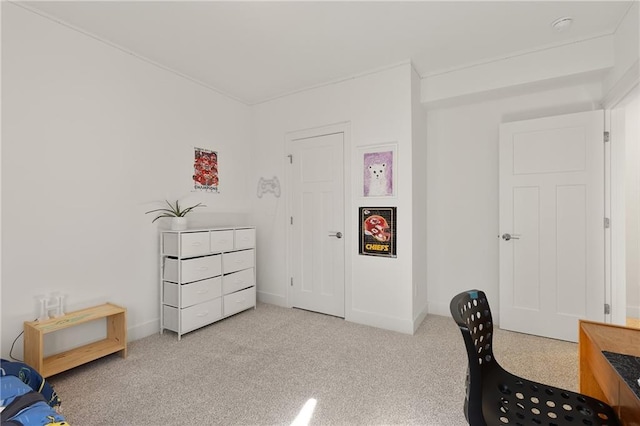 carpeted office featuring baseboards