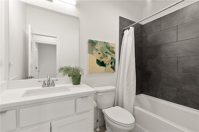 bathroom featuring shower / bath combo, vanity, and toilet