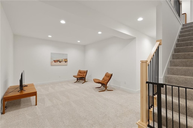 sitting room with baseboards, carpet floors, stairway, and recessed lighting