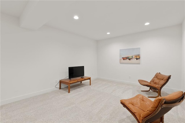 sitting room featuring light carpet, baseboards, and recessed lighting