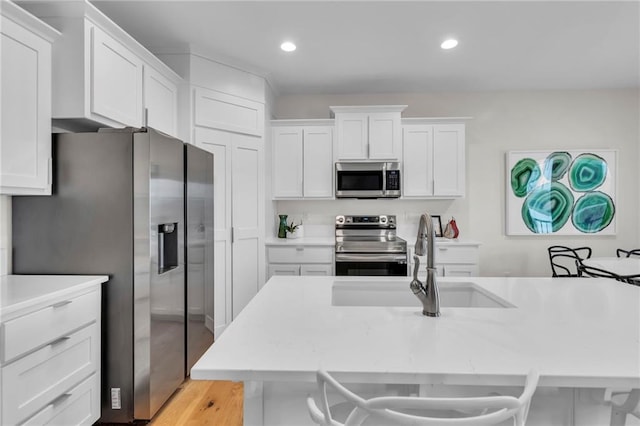 15171 W 173rd St, Olathe, KS 66062 - kitchen with white cabinets, stainless steel appliances, light countertops, and a sink