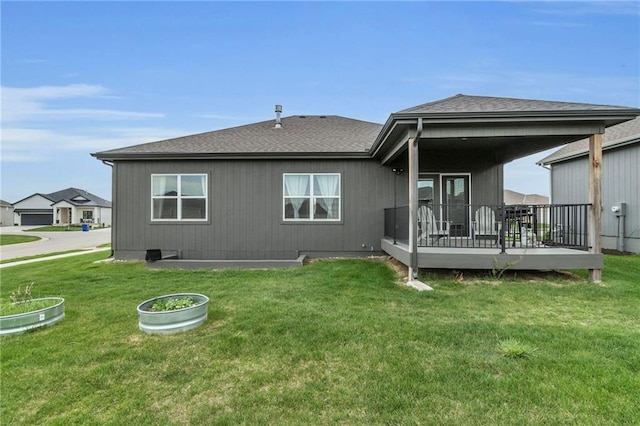 15171 W 173rd St, Olathe, KS 66062 - rear view of house featuring a lawn, a wooden deck, and a shingled roof