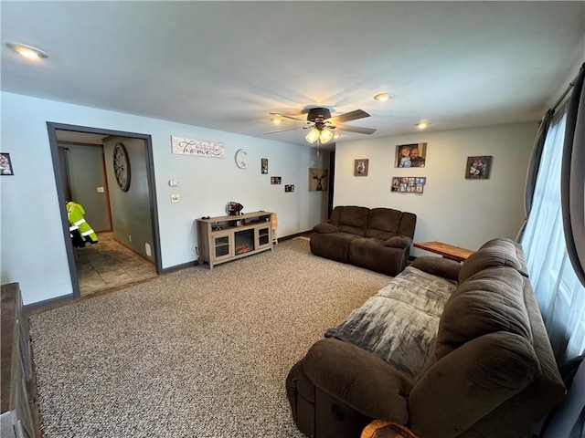 living room featuring ceiling fan and light carpet