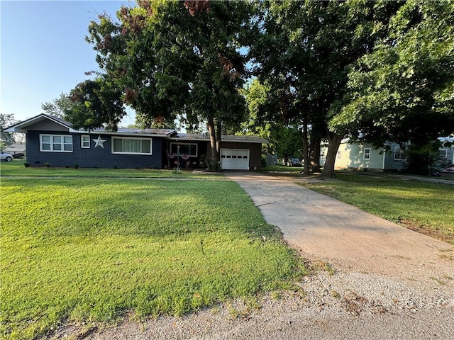 ranch-style house with a garage and a front yard