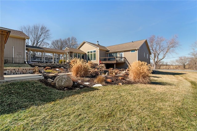 rear view of house with a yard