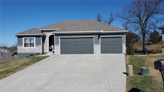 view of front of property featuring a garage, stone siding, driveway, and stucco siding