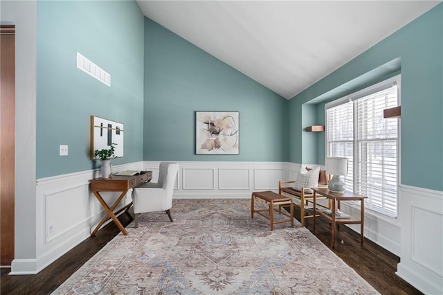 sitting room with lofted ceiling and dark hardwood / wood-style floors