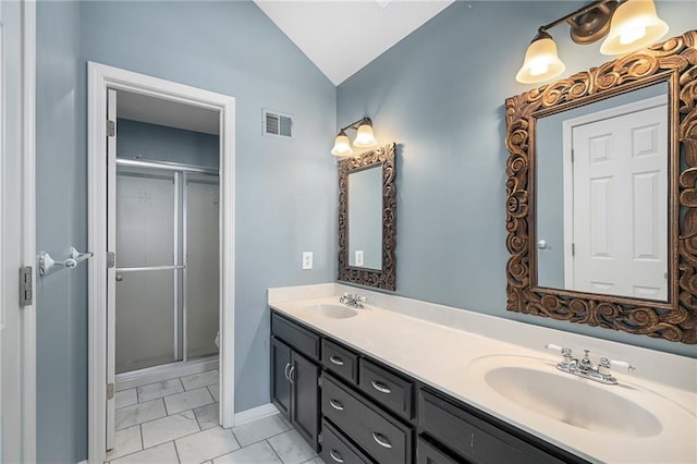 bathroom with vanity, vaulted ceiling, a shower with door, and toilet