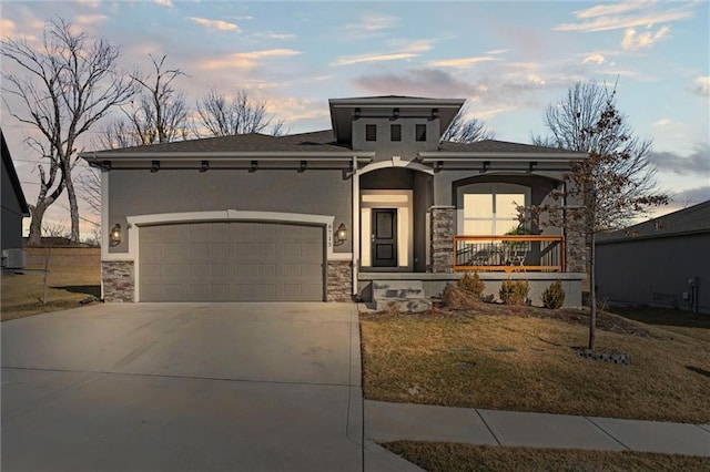 view of front of property with a garage, stone siding, concrete driveway, and stucco siding