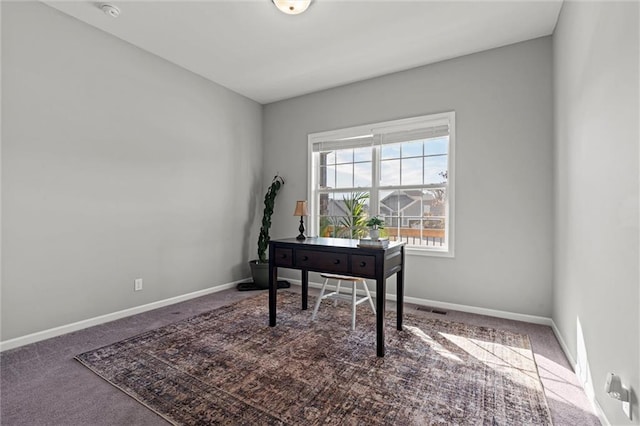 home office featuring carpet flooring, visible vents, and baseboards