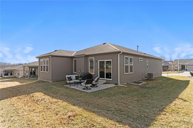 back of house with a patio, a yard, and central air condition unit