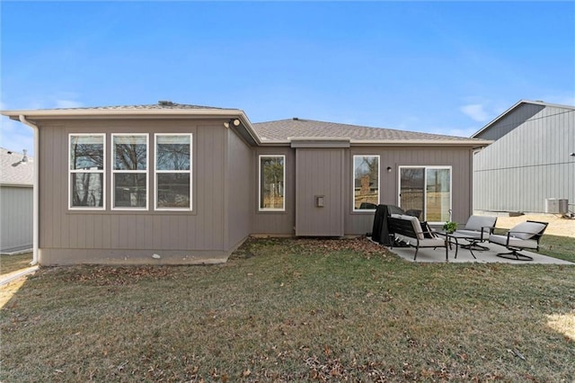 rear view of property with a patio area and a lawn