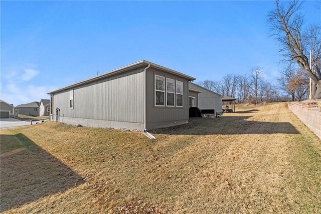 view of property exterior featuring a lawn