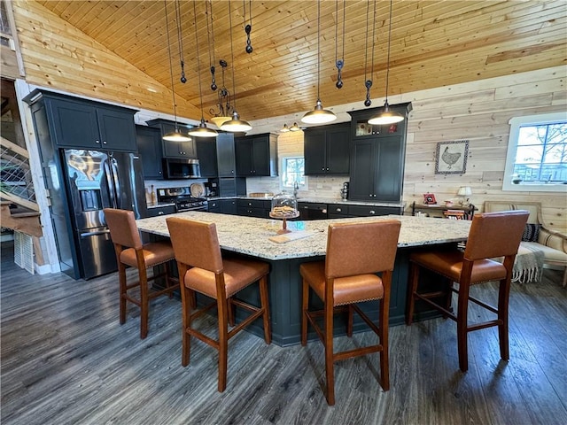 kitchen with stainless steel appliances, wood ceiling, dark wood-type flooring, and a spacious island