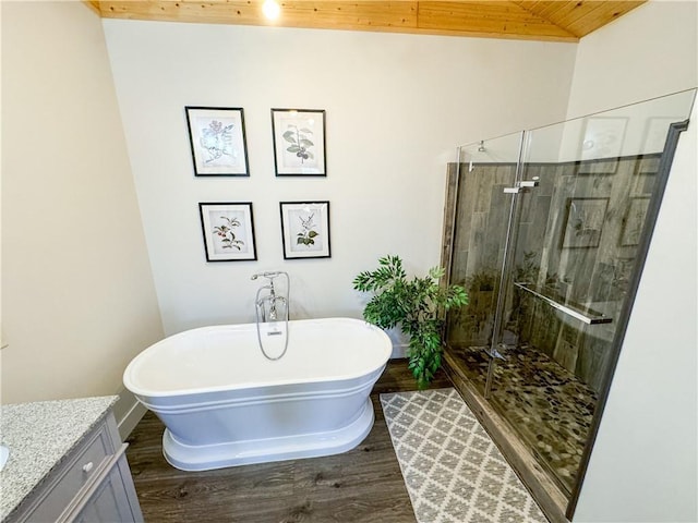 bathroom with wood ceiling, wood finished floors, a freestanding bath, vanity, and a shower stall