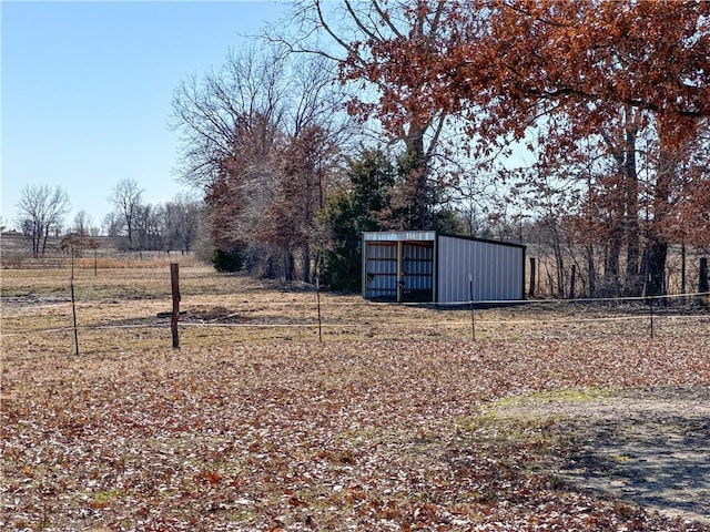 view of yard with an outbuilding and a pole building