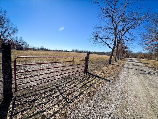 view of gate featuring a rural view